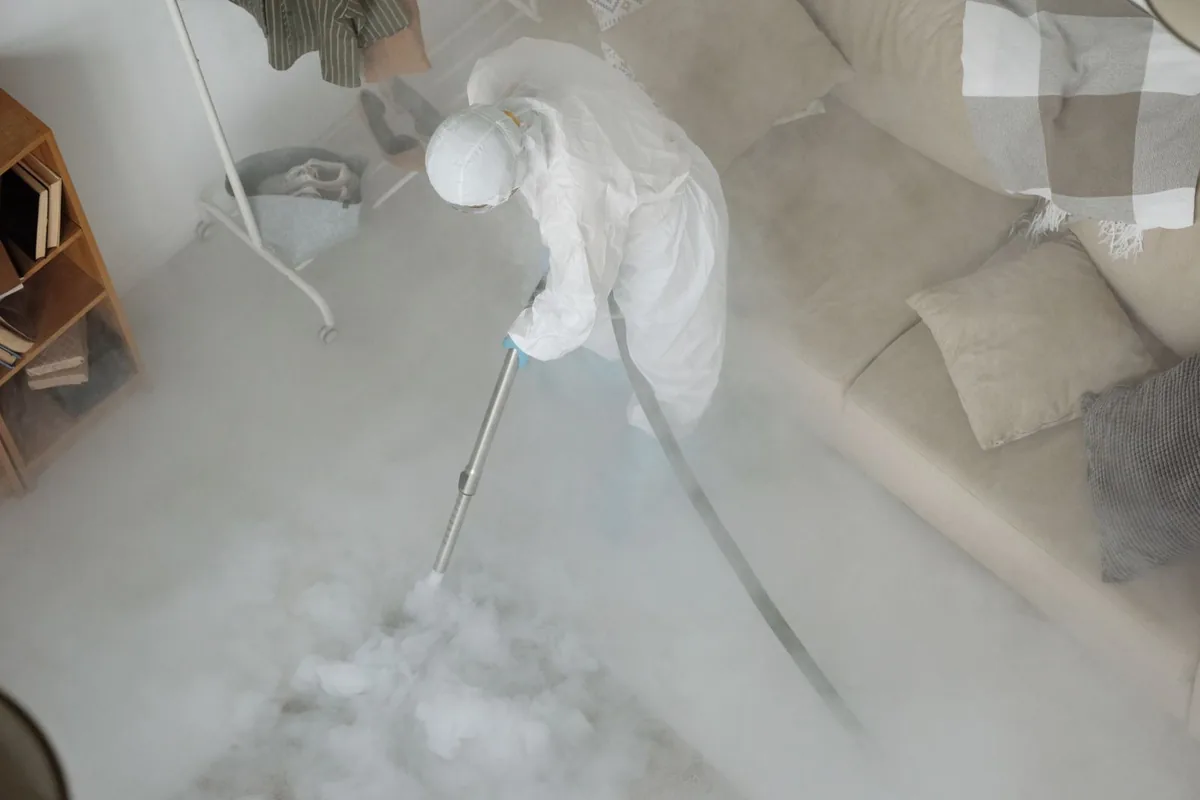 Biohazard cleanup technician in protective equipment, Fall River, WI